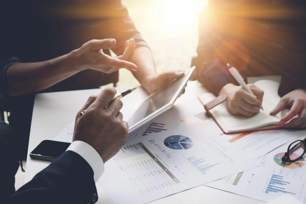Group of business people busy discussing financial matter during meeting. Corporate Organisation Meeting Concept with vintage tone